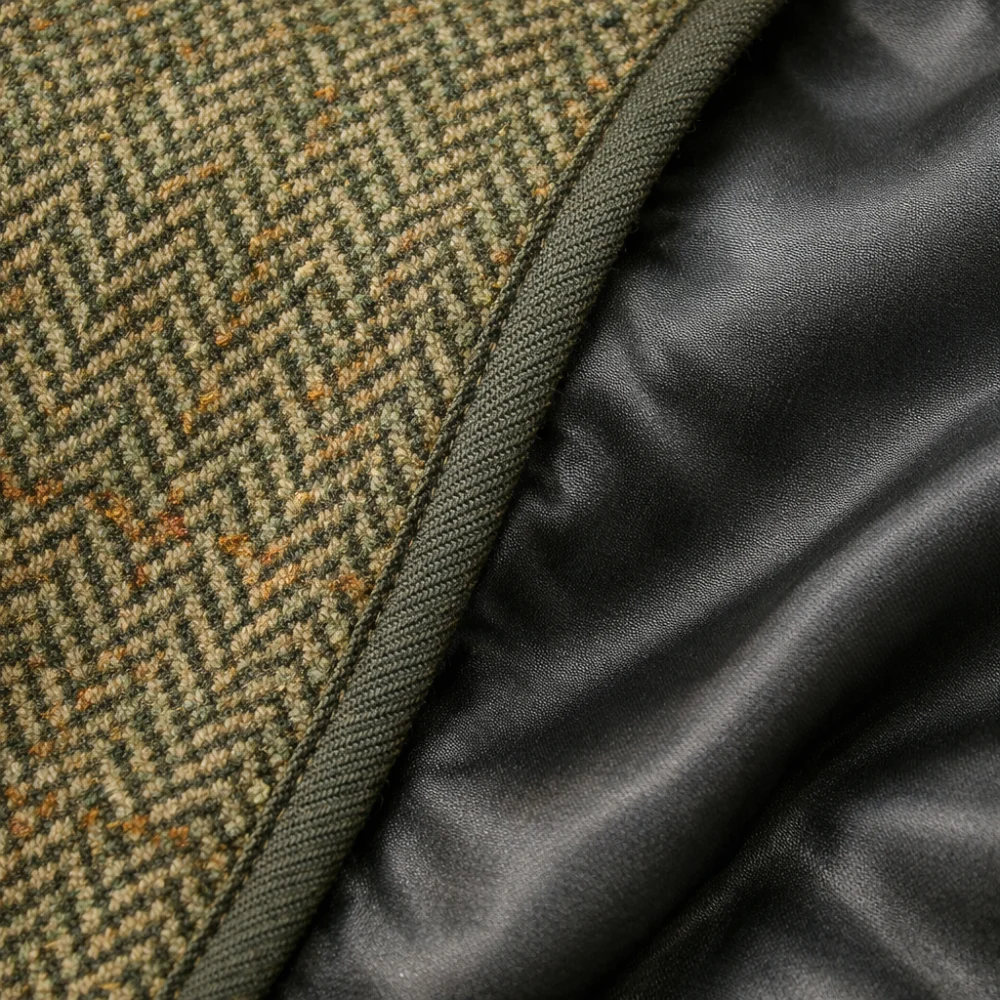 Close-up of tweed fabric texture and lining edge